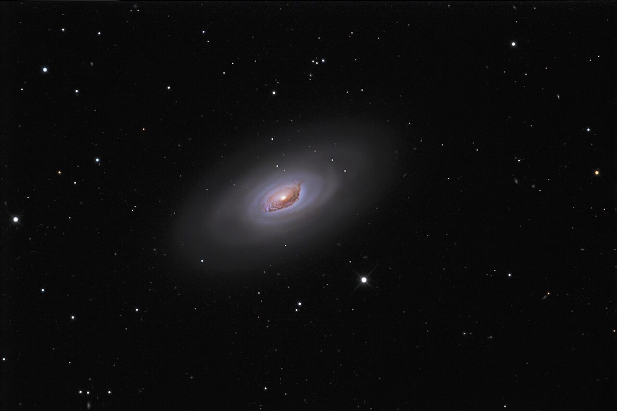 Photograph of Black Eye Galaxy (M64), a spiral galaxy in Coma Berenices